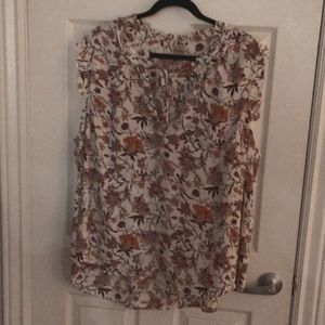 Sleeveless floral top.  Split front with tye.